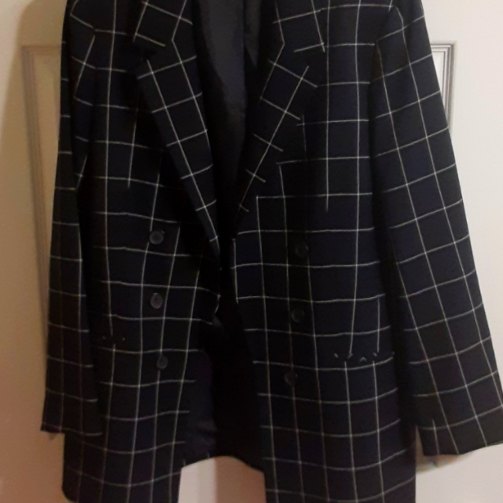Women dressed black blazer with white checkered stripes